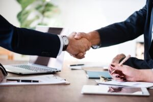 Two males shaking hands