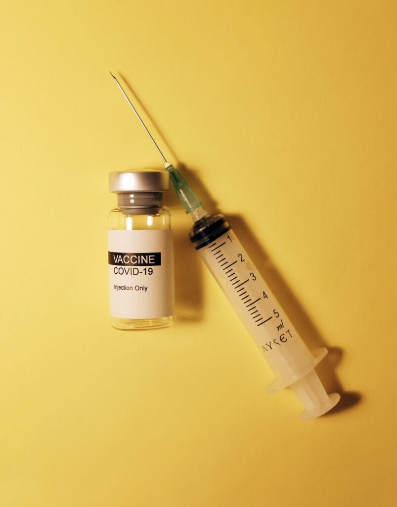 Covid vaccine and syringe