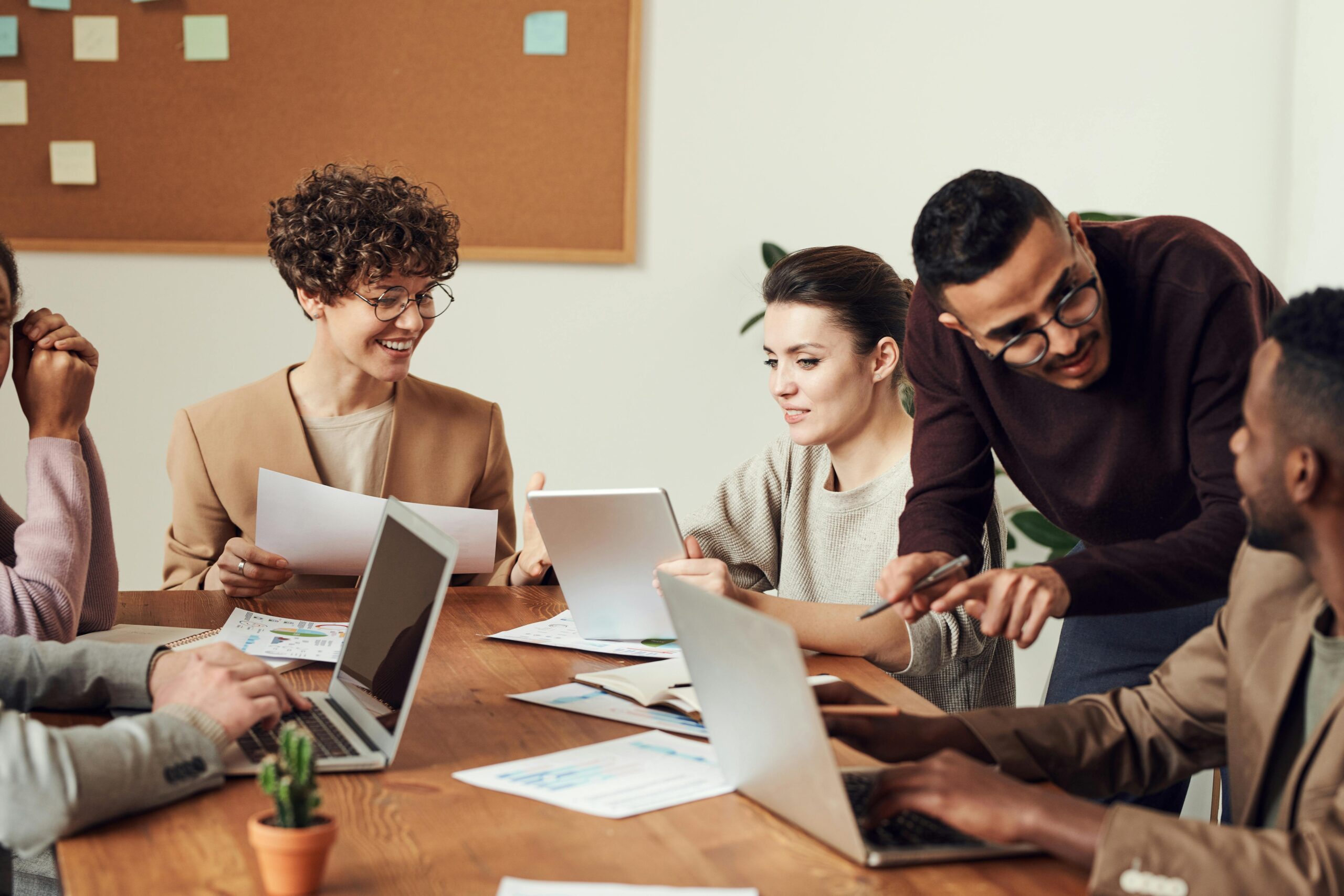 A group of colleagues working together around a table