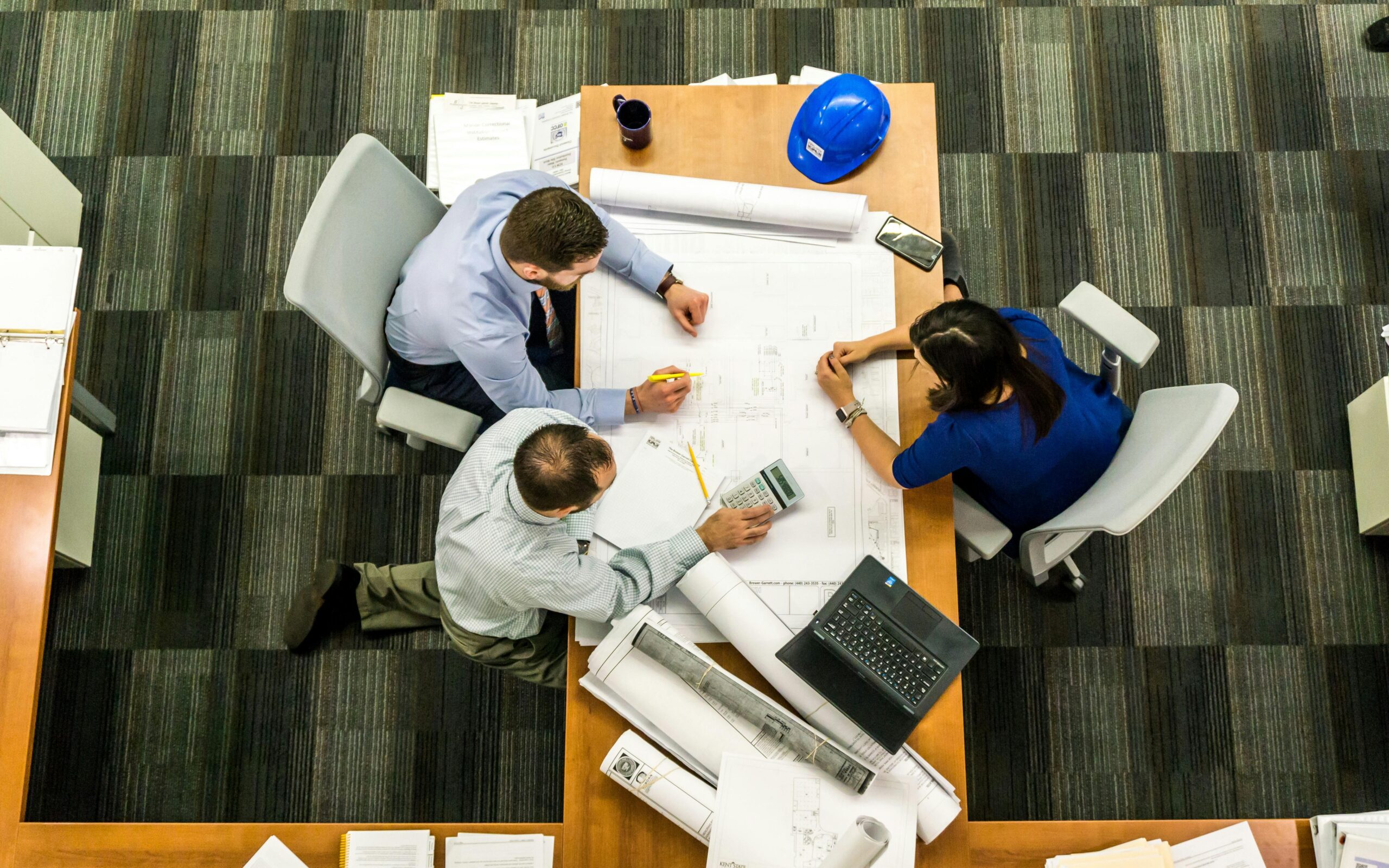 Colleagues working on a project together at a table